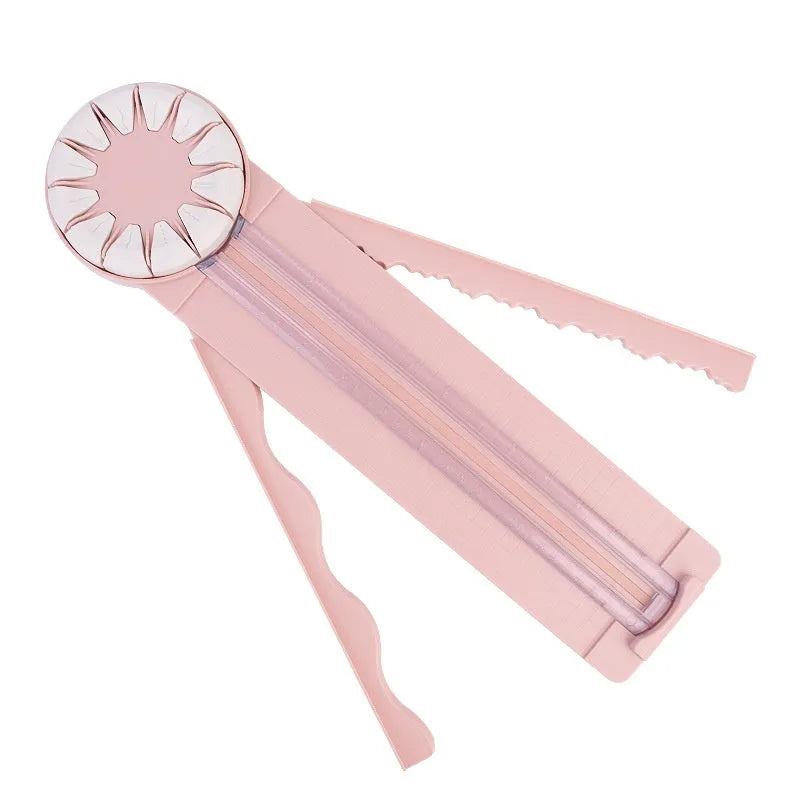 Plastic 12-in-1 paper cutting machine in pink or black colours with dotted cutting mechanism