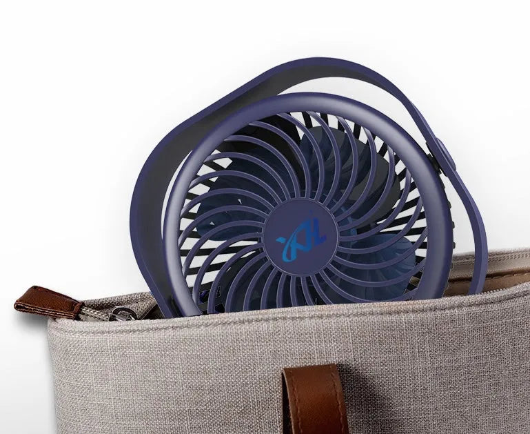 Blue USB desk fan with alarm clock display and plastic blades on a white desk.