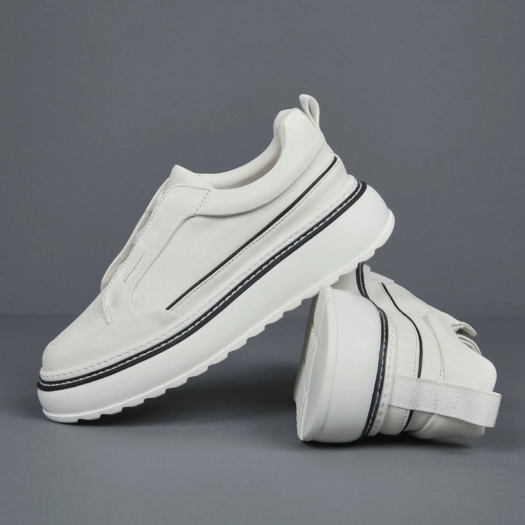 Black casual slip-on sneaker with leather upper, foam platform sole, and elastic band – side view
