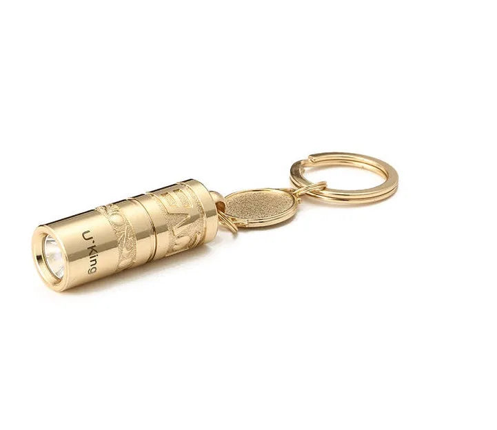 Gold zinc alloy waterproof LED keychain torch for outdoor and emergency use.