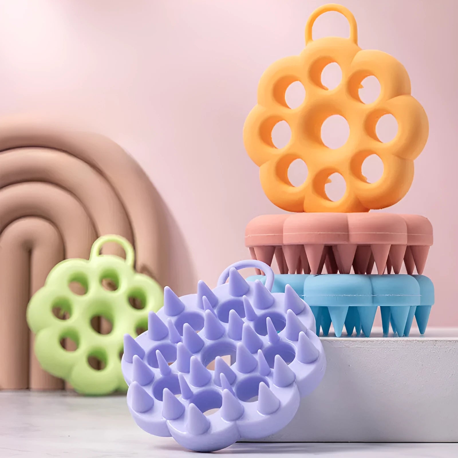 Silicone pet grooming brush with ergonomic handle shown in blue, for washing and brushing dogs and cats.