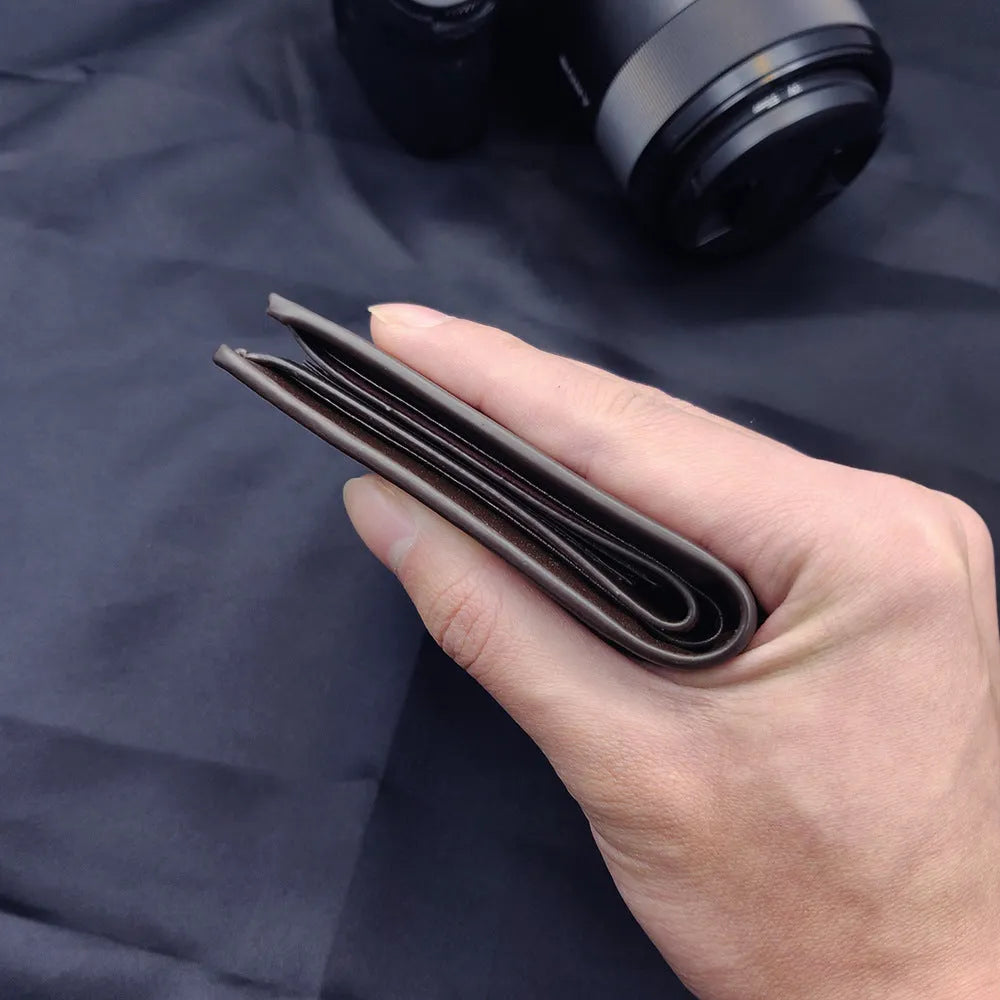 Men's brown leather zip wallet presented in gift packaging