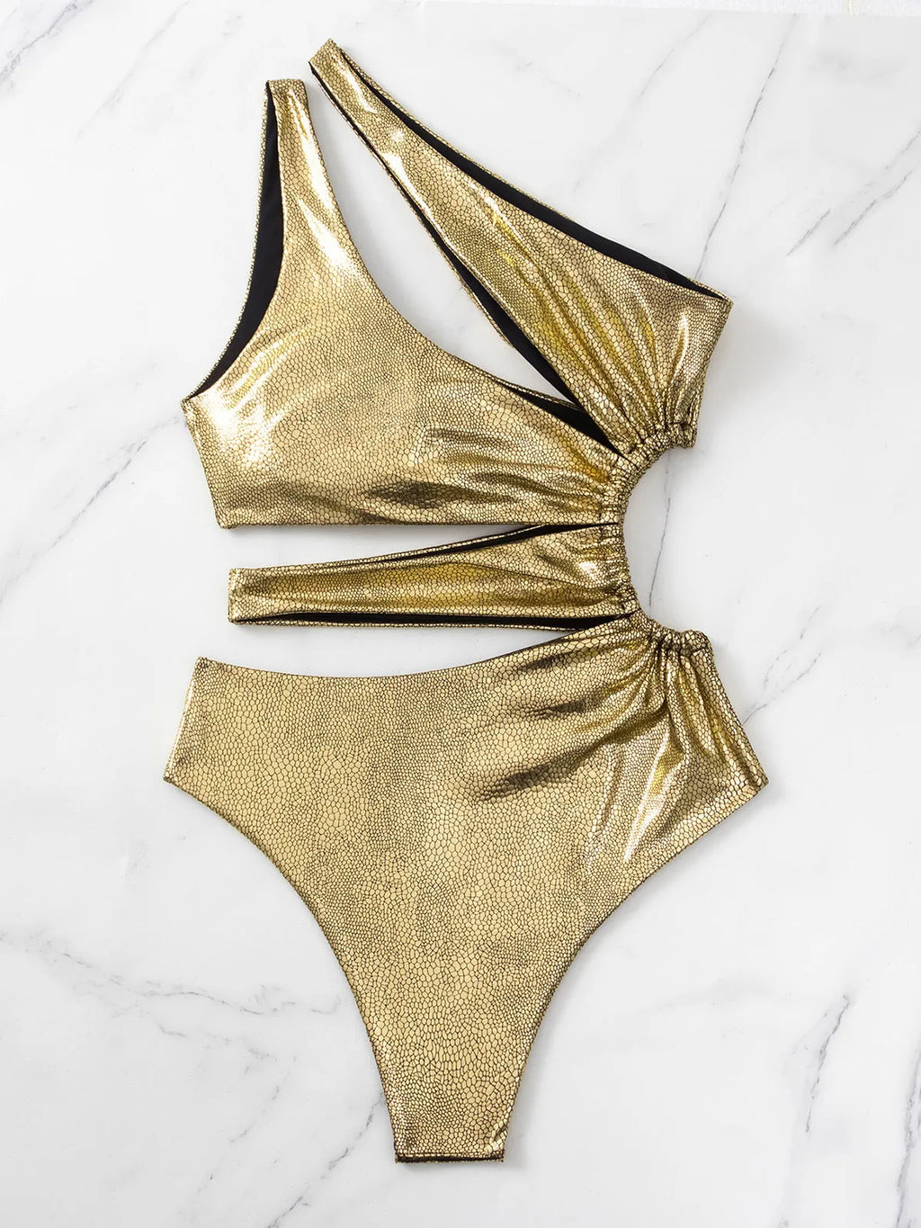 Gold backless one-piece swimsuit for women on a mannequin, showing sleeveless design.