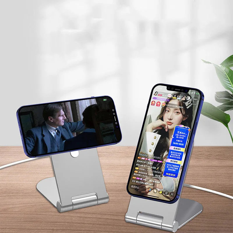 Silver vertical adjustable magnetic phone bracket for iPhone 12 shown in a car and on a desk.