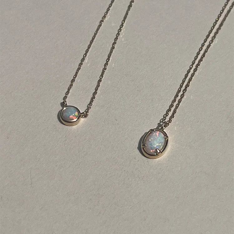 Simple geometric oval jelly opal pendant necklace on S925 silver chain in gold or white gold finish.