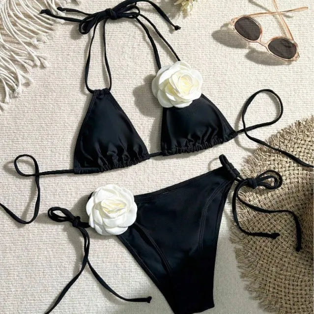 Black women's bikini swimsuit with 3D flower lace detailing and backless split design