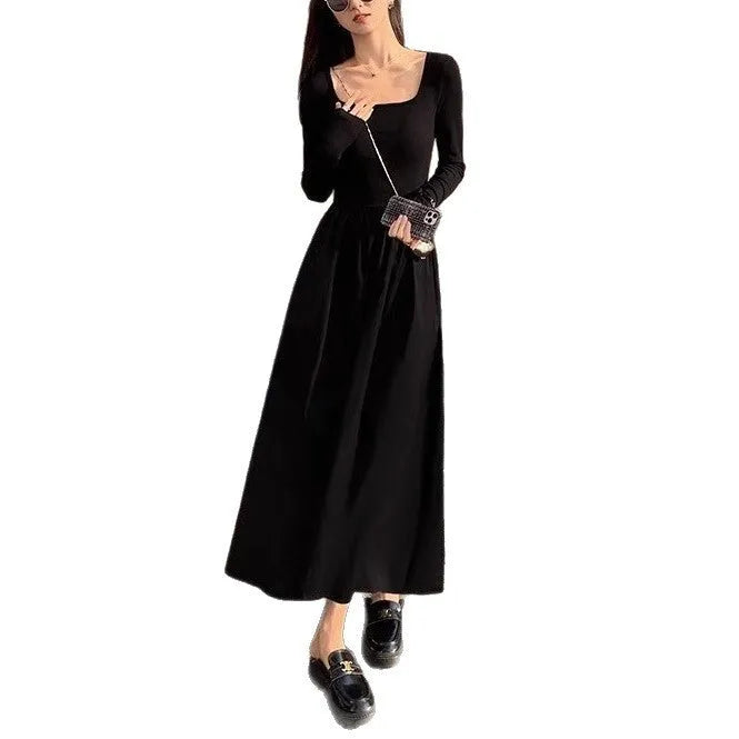 Black square collar long sleeve knitted dress with elastic waist and A-line skirt.
