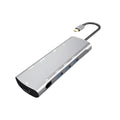 Grey aluminium USB-C docking station with HDMI, VGA, USB 3.0, and USB-C PD charging ports.