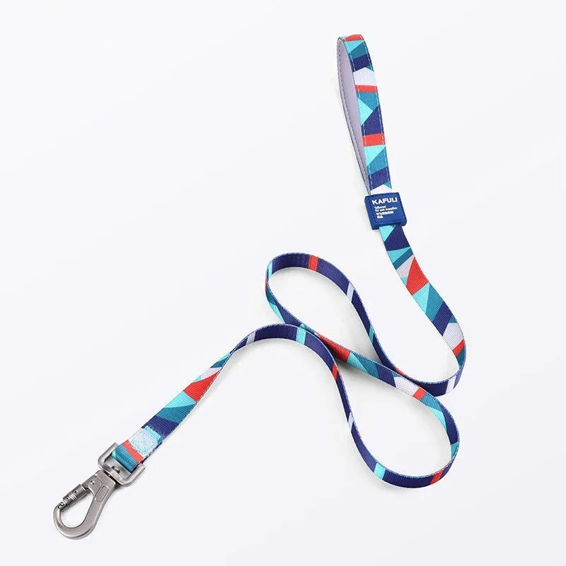 Blue polyester dog vest with attached haulage rope set on adjustable chest strap.