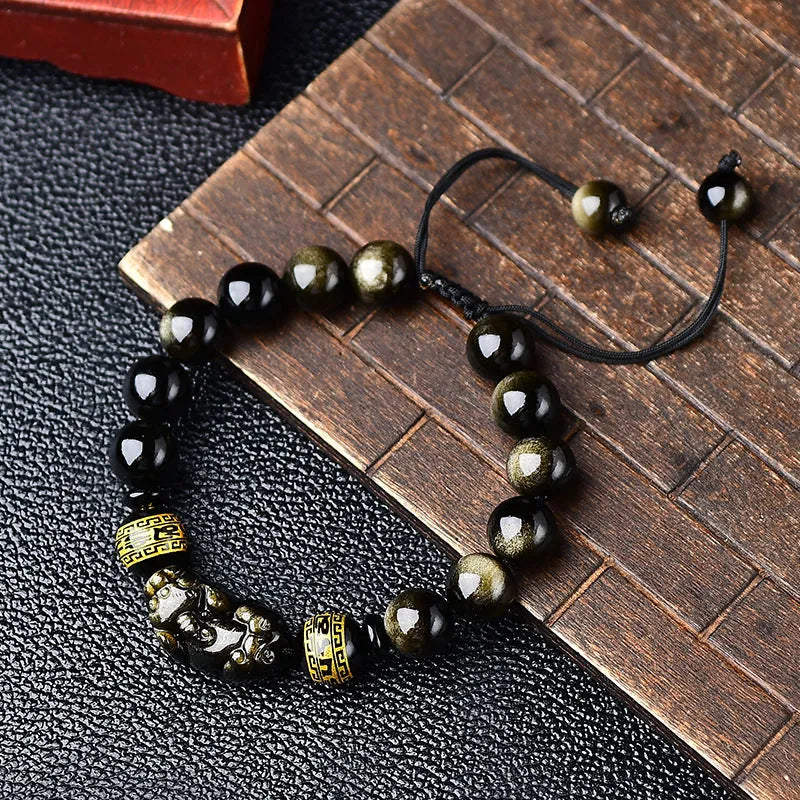 Hand-woven golden obsidian bracelet with Pi Xiu charm in 8mm, 10mm, 12mm, and 14mm bead sizes.