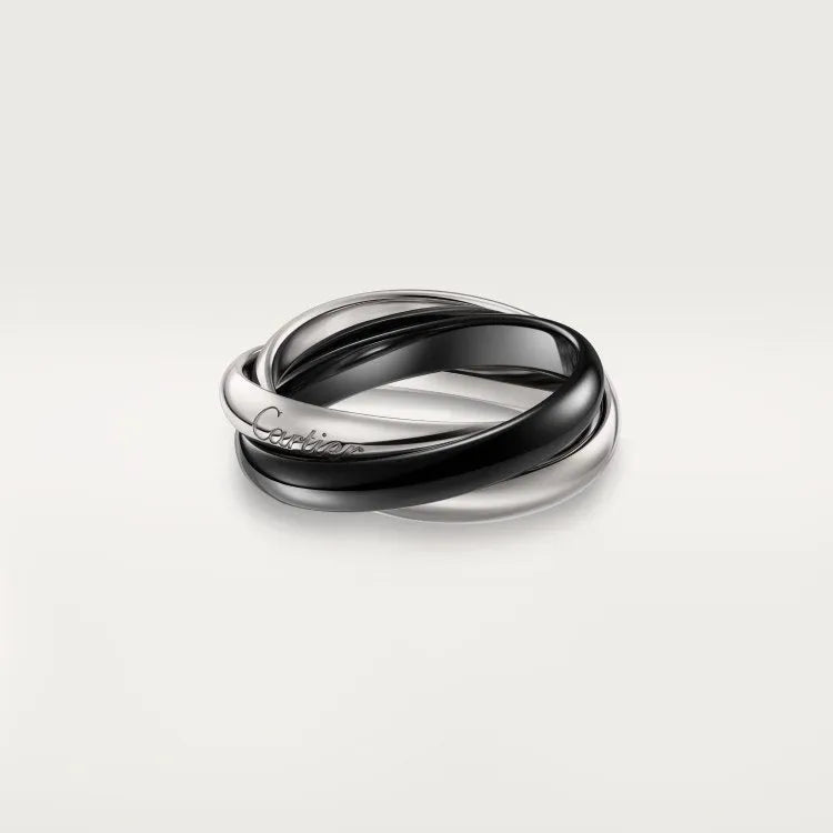 Sterling silver couple ring with full diamond setting and U-shaped geometric design on a finger.