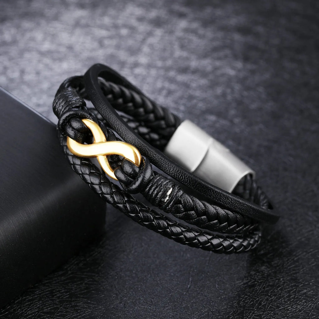 Black vintage leather bracelet with titanium steel clasp on display, 20cm length