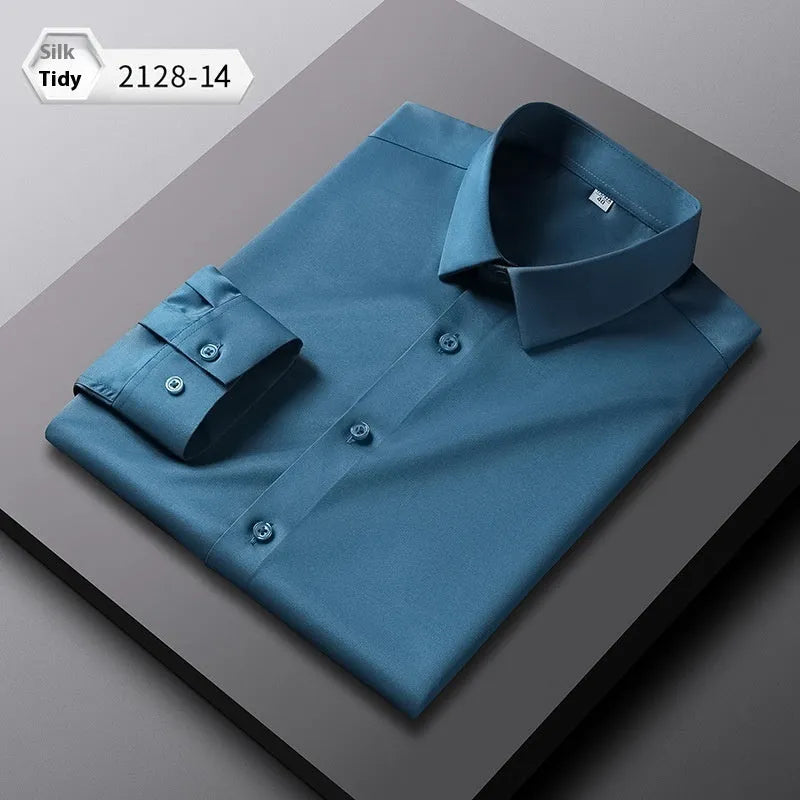 Man wearing a solid colour long-sleeved non-ironing shirt made from elastic polyester spandex fabric.