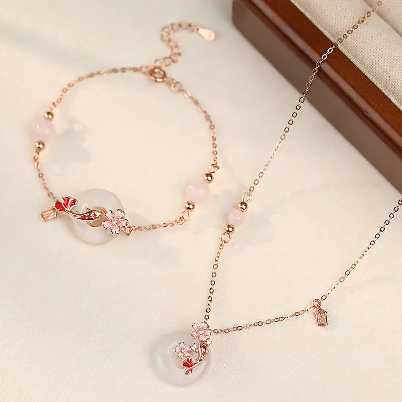 S925 sterling silver bracelet with white chalcedony flower and koi fish design in New Chinese style.