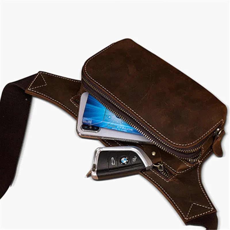 Brown cowhide leather men's waist bag with pull closure, shown with internal mobile phone compartment.
