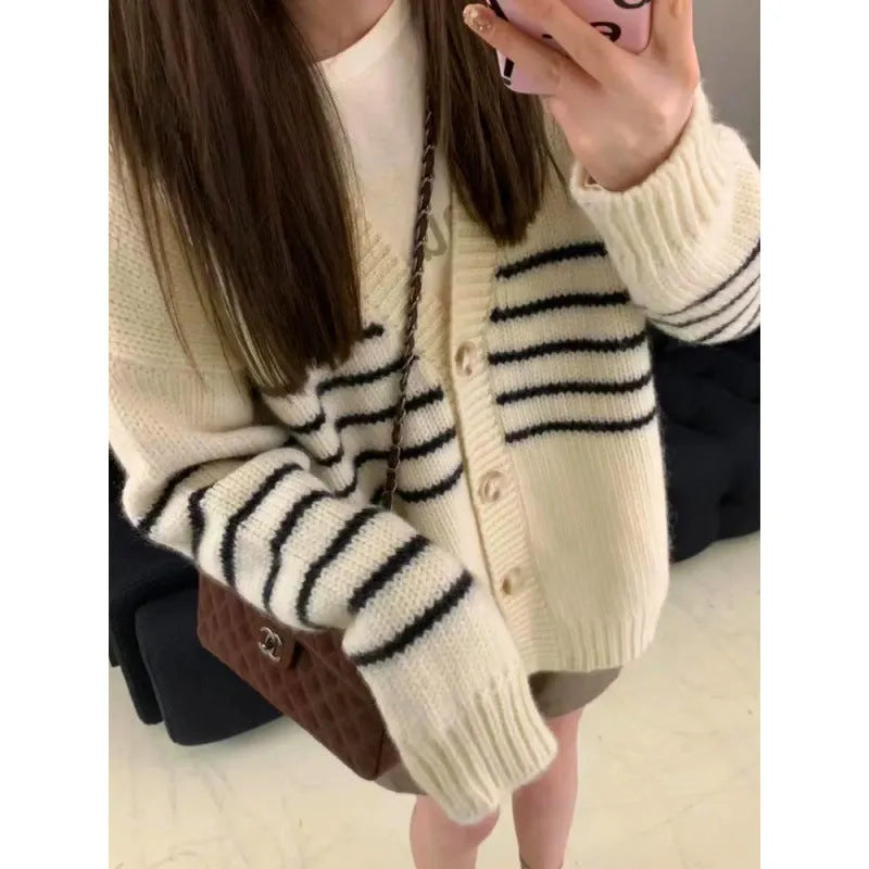 Japanese Korean style cardigan sweater with 3D pattern and button collar on a hanger.