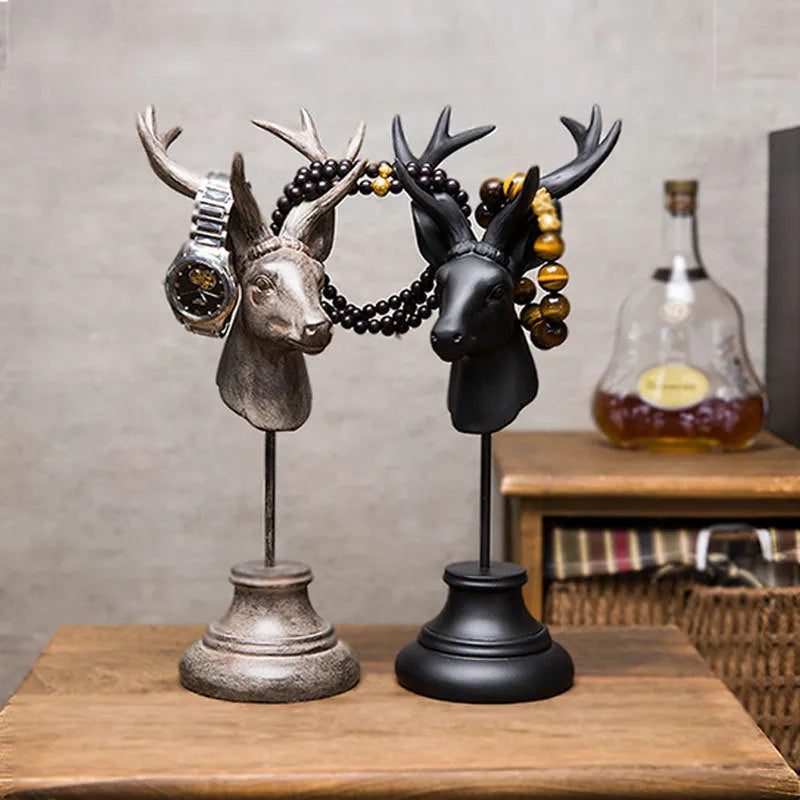 A tall black resin animal sculpture ornament for home decoration on a wooden surface.
