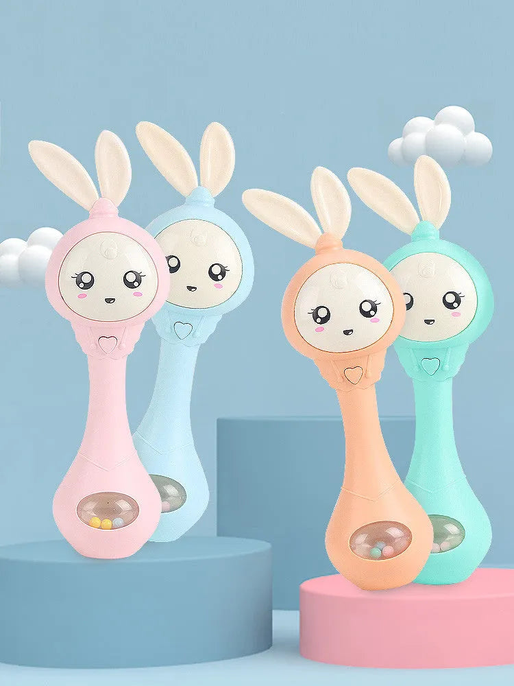 Baby molar music stick teether in light blue, mint green, orange or pink with chewable surface and electronic components