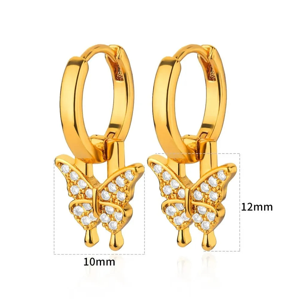 Geometric butterfly earrings with heart and star shapes in copper with diamond treatment