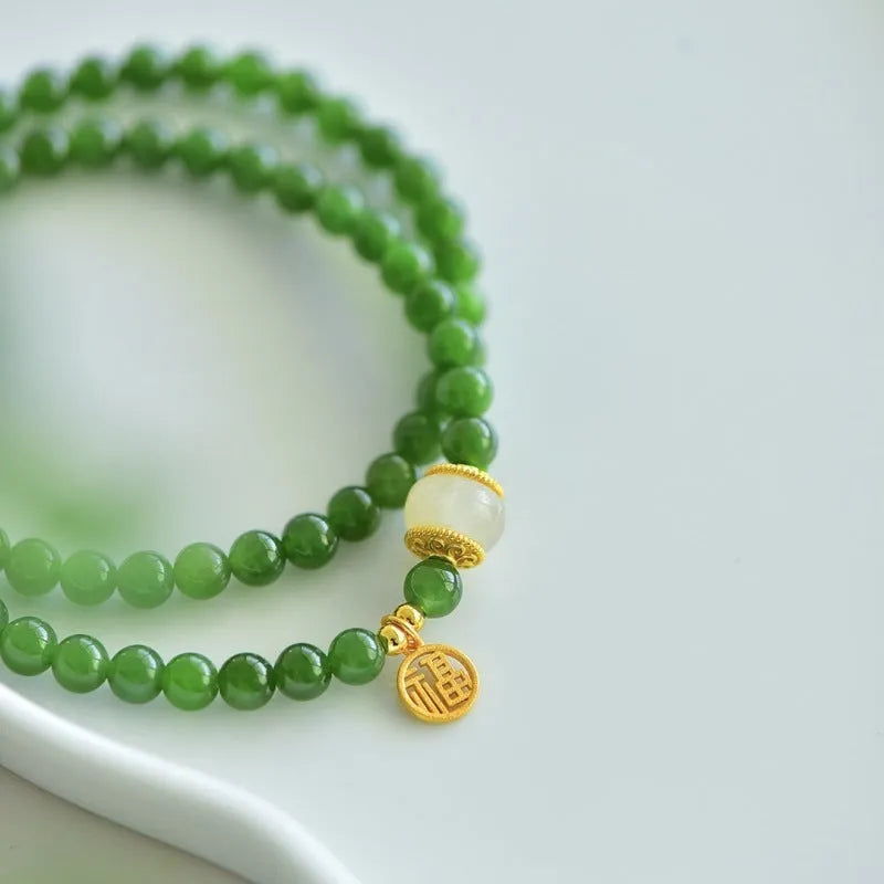 Women's double circle Hetian jade bracelet with engraved fu character in geometric design
