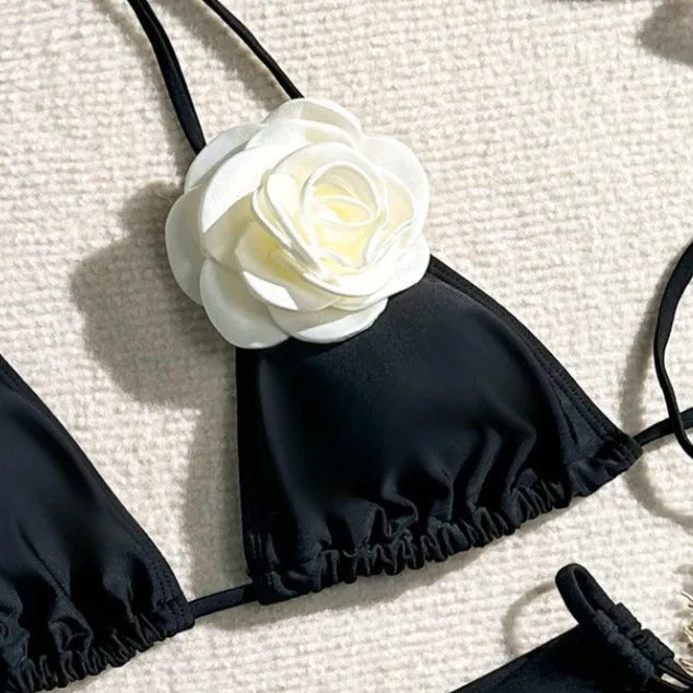 Black women's bikini swimsuit with 3D flower lace detailing and backless split design