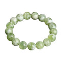 Green milk-in-water Xiuyan jade bracelet with geometric beads in single circle design