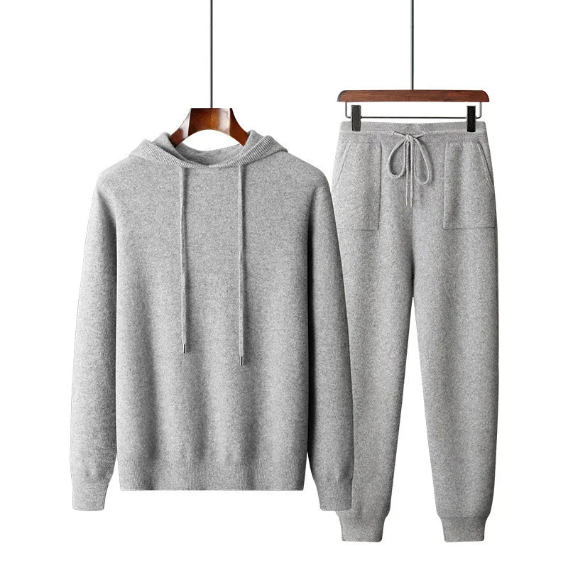 Men's light grey cashmere-blend hooded sweatshirt and matching joggers laid flat.
