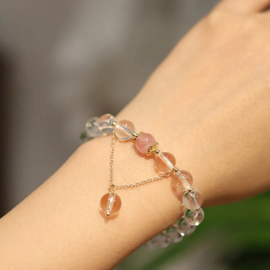 Chinese style geometric crystal bracelet with cat eye obsidian effect and auspicious patterns.