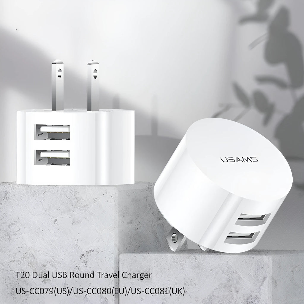 White universal USB phone charger with foldable US, UK, and EU plugs showing compact design