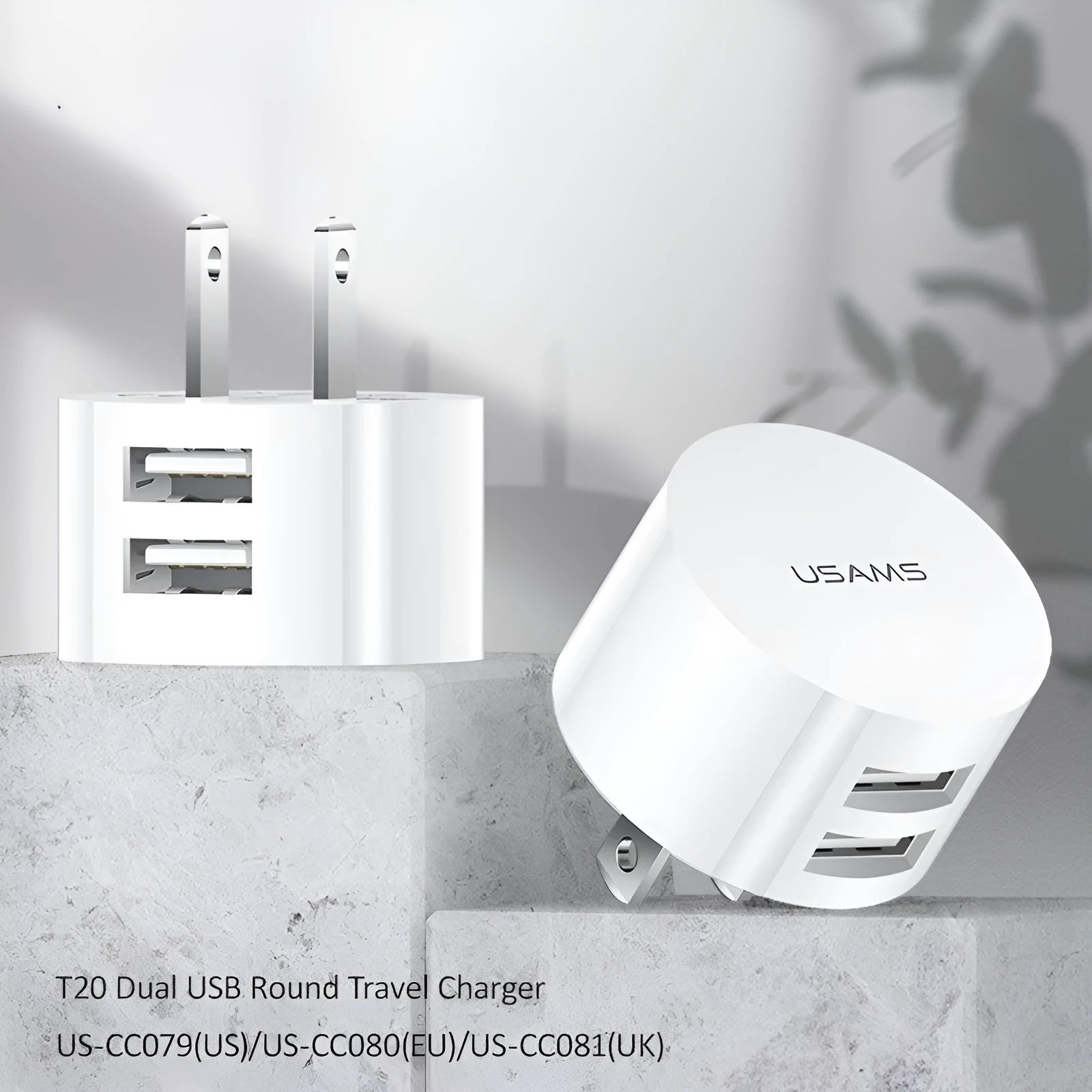 White universal USB phone charger with foldable US, UK, and EU plugs showing compact design