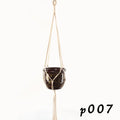 Woven wire planter basket made from cotton rope, shown in a desktop style holding a small plant.