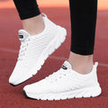 Women's running shoes with fly weaving upper in black, pink, or white colours showing breathable construction