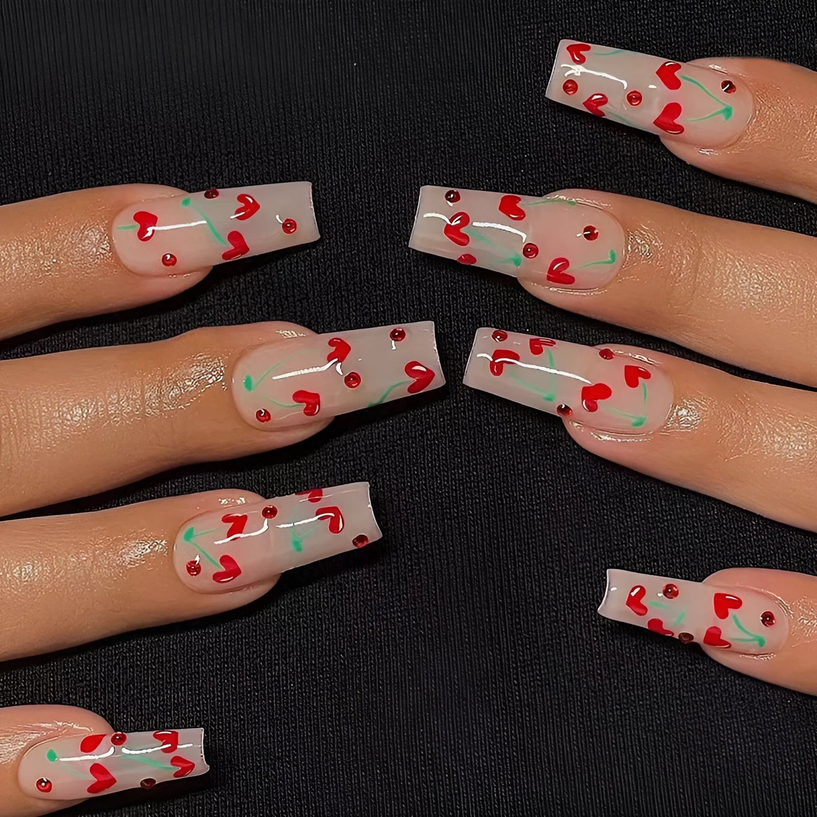 French-style red diamond and small cherry design nail art armour sheets and glue tube.