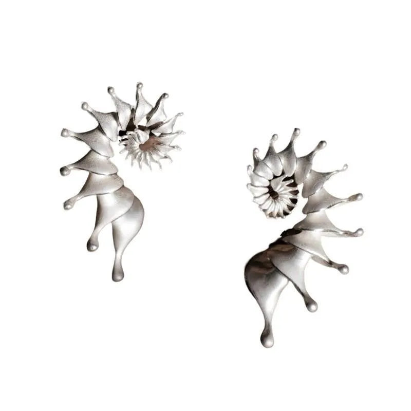 Conch colour three-dimensional matte alloy stud earrings with irregular geometric design