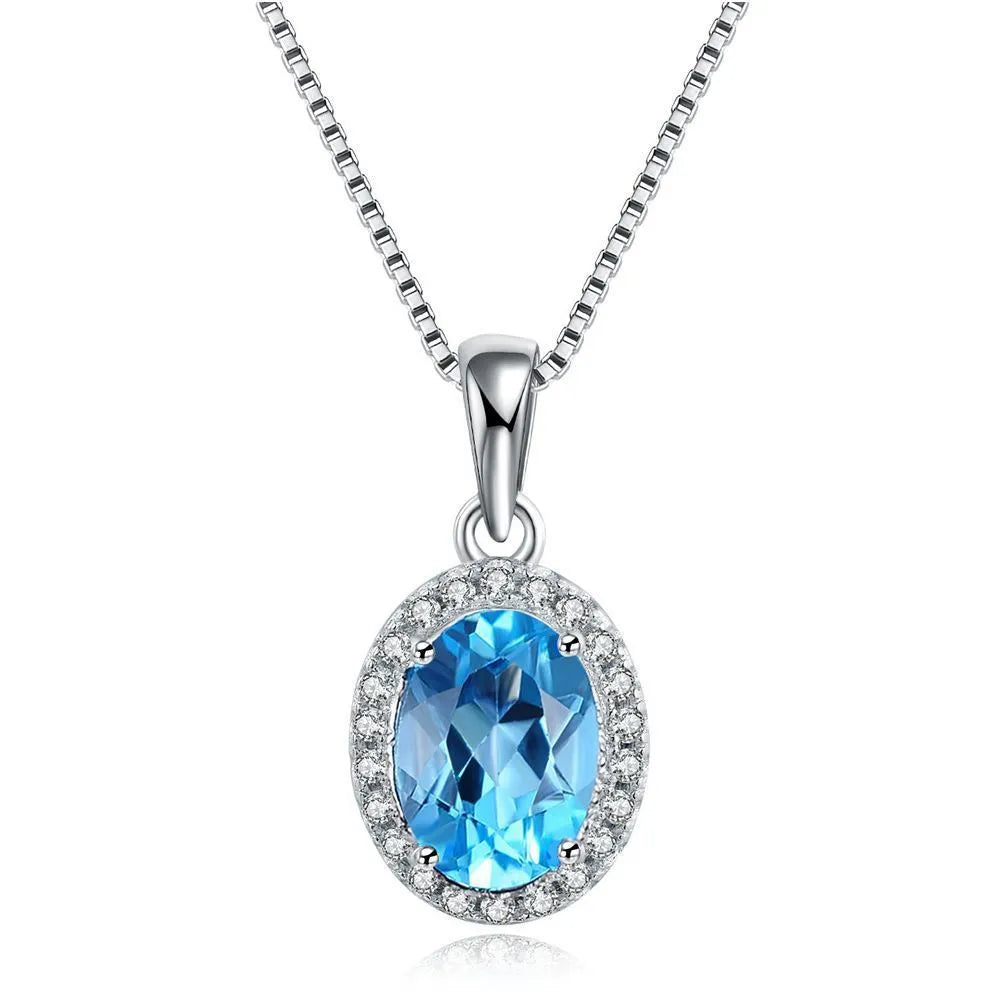 925 sterling silver blue topaz jewellery set with geometric design including earrings, necklace, ring and pendant