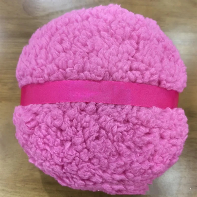 Oversized rectangular plush powder puff in pink, white, or skin colour for dry makeup application.