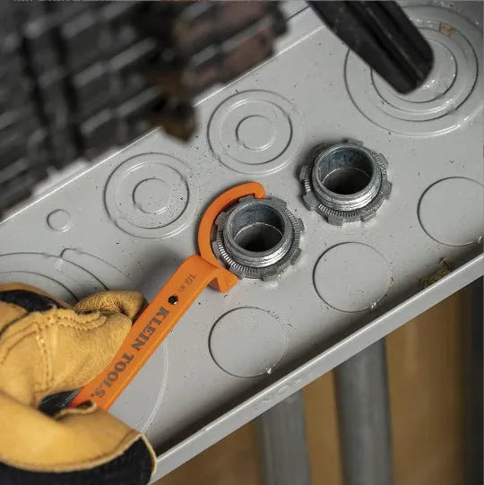 Three magnetic catheter locking wrenches in orange, grey, and black colours displayed together.