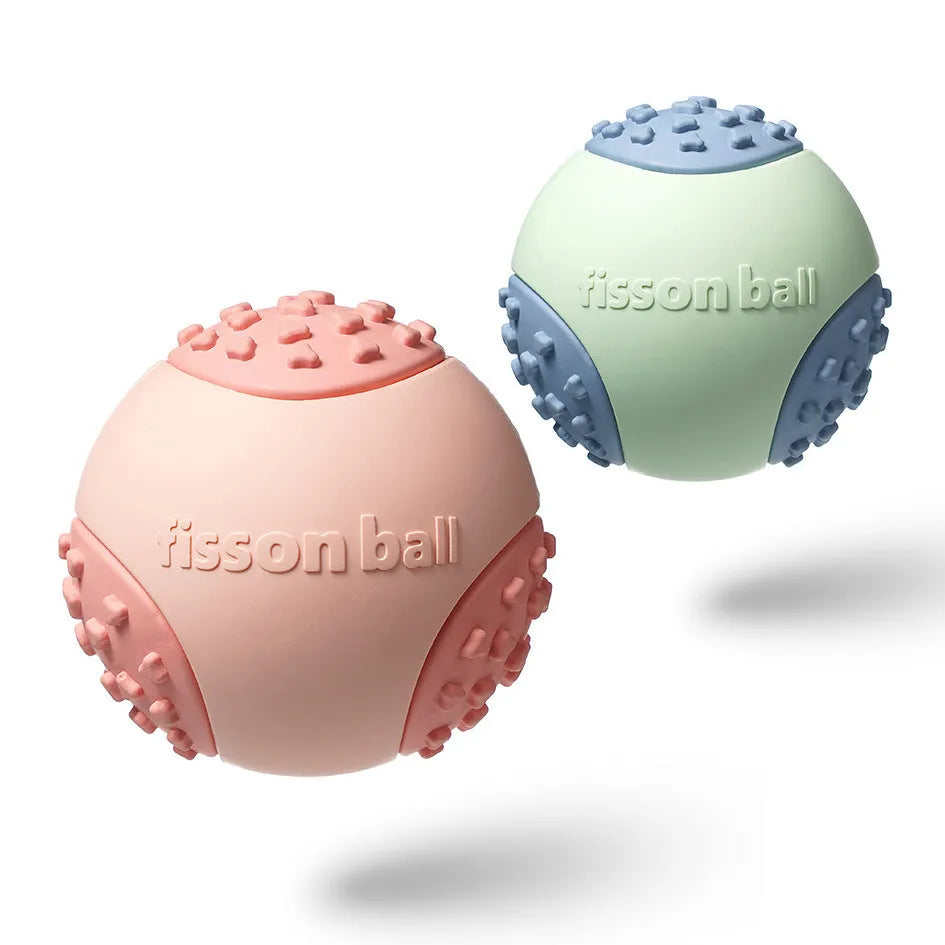 Green and pink rolling ball dog toys showing 64mm diameter size for interactive pet play