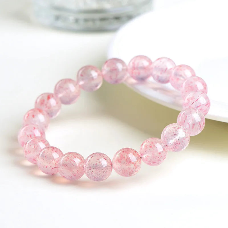 Strawberry quartz crystal ball bracelet with geometric beads measuring 10-10.8mm