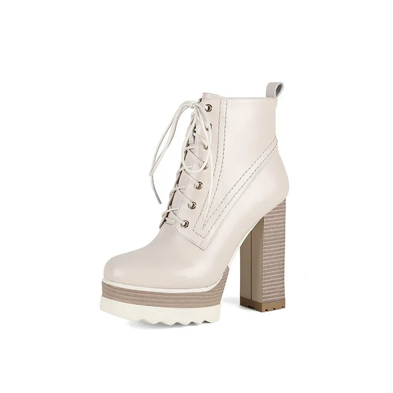 Women's black chunky heel waterproof ankle boots with a side zipper and round toe.