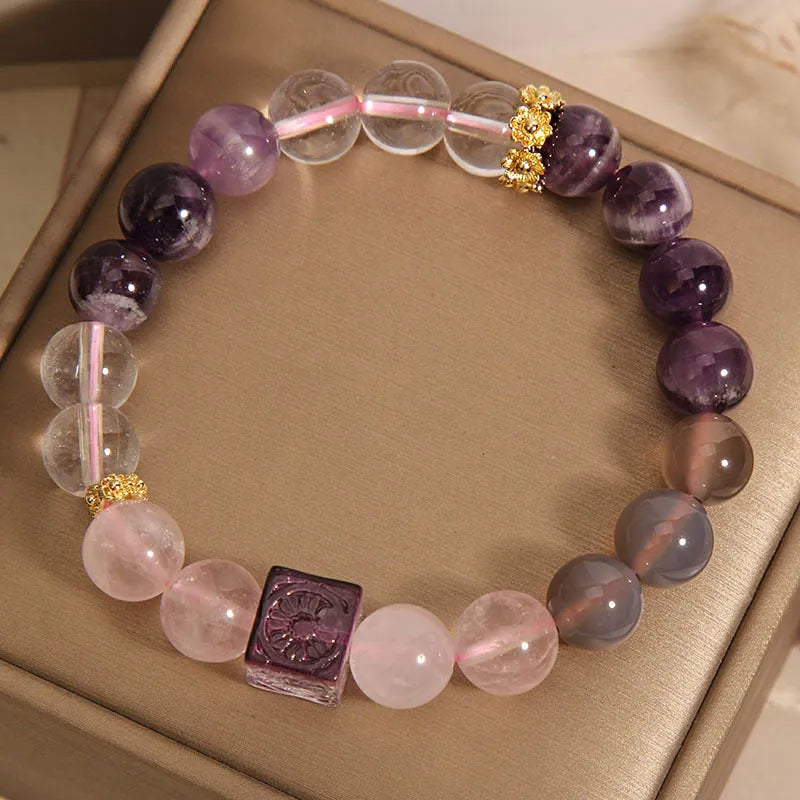 Purple women's amethyst crystal bracelet with rhinestone detailing measuring 10mm diameter