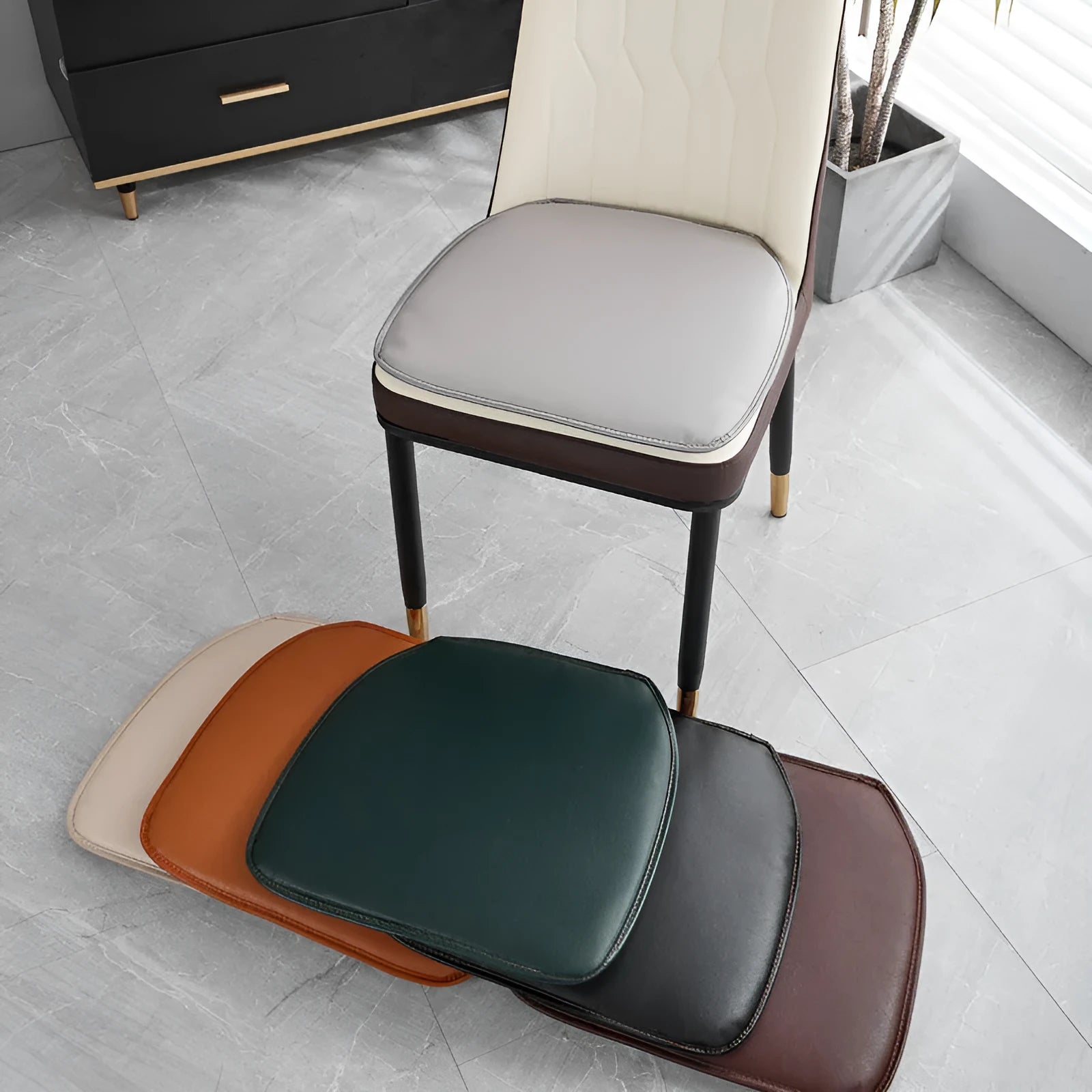 Leather horseshoe-shaped seat cushion in beige colour on a dining chair.