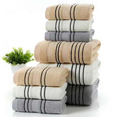 Cotton towel set showing white, grey and khaki bath towels with 34x74cm and 70x140cm dimensions