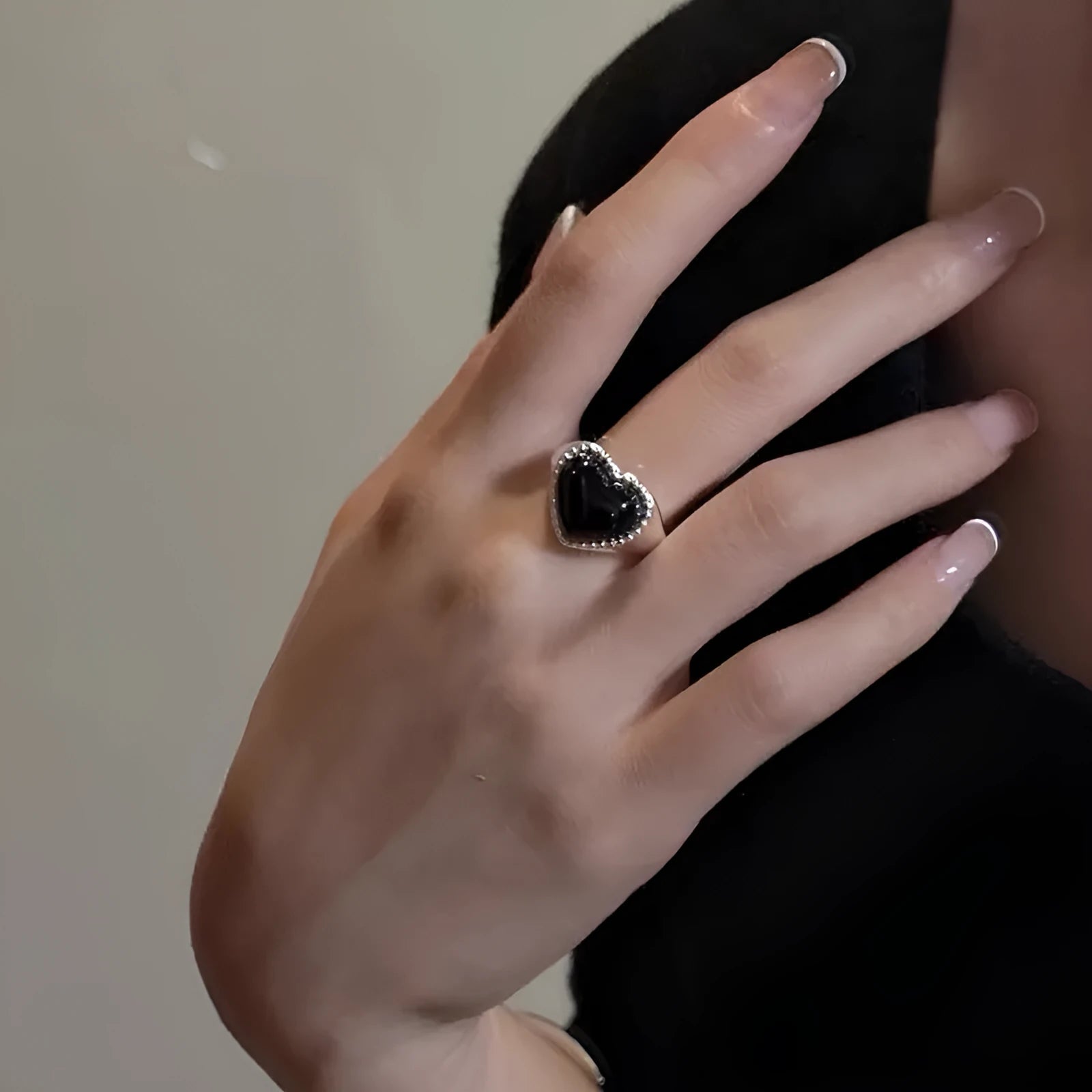Adjustable S925 sterling silver ring with black agate heart design