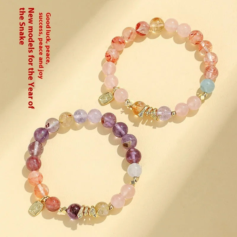 Handmade women's crystal lucky bracelet with Fu snake charm and amethyst beads.