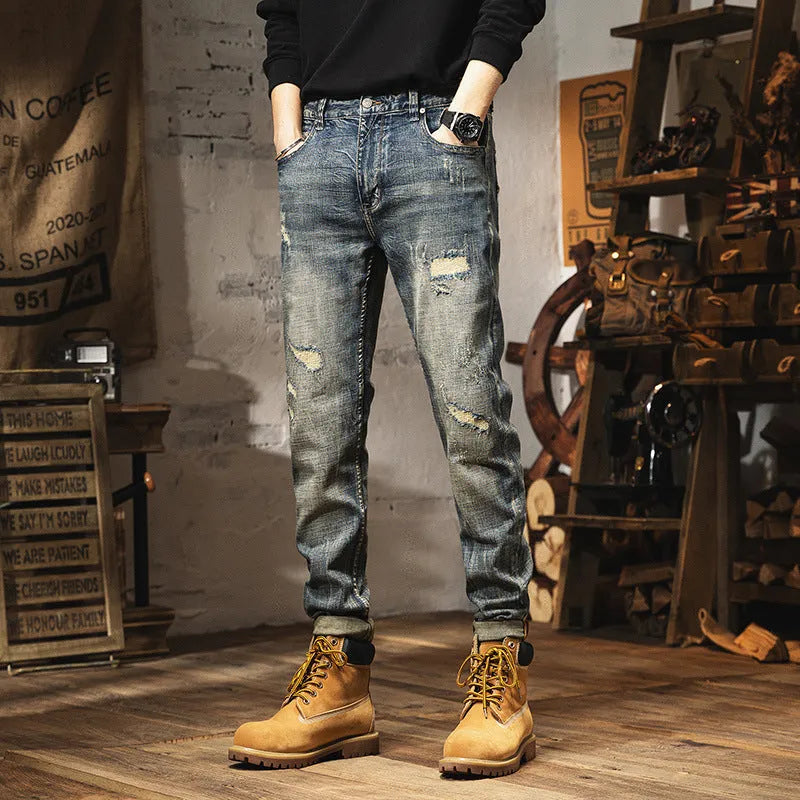 Man wearing vintage blue loose-fit jeans with a drawstring waist, showcasing the fleece-lined interior.