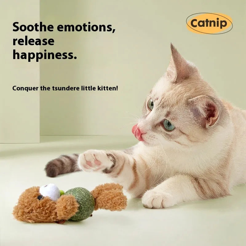 Soft plush cat toy in the shape of a bear, containing catnip and a bell, next to a measuring tape showing 15cm.