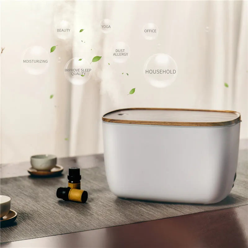 GX-22K white household atomizer humidifier and diffuser with night light on a wooden table