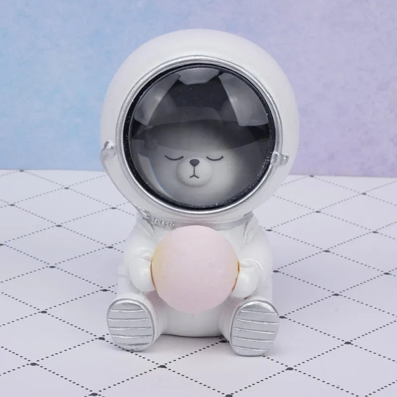 Resin animal night light in bear design with starry sky LED glow on a table.