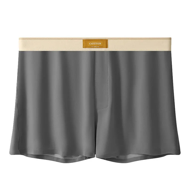 Pack of three men's solid colour ice silk boxer shorts laid flat.